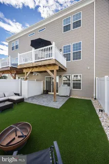 a view of a balcony dining area with chairs