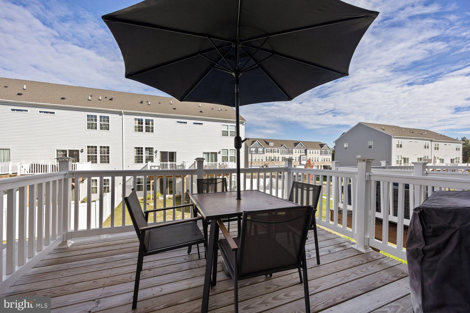 69 Sister's Farmstead Rd Mount Mount Laurel, NJ 08054 - Photo 21 of 44 a view of a balcony dining area with chairs