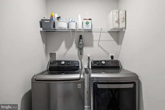 a bedroom with a large bed and a flat tv screen on dresser