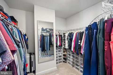 a bathroom with a granite countertop sink a mirror and a vanity