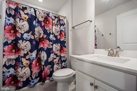 a bedroom with furniture and a large window