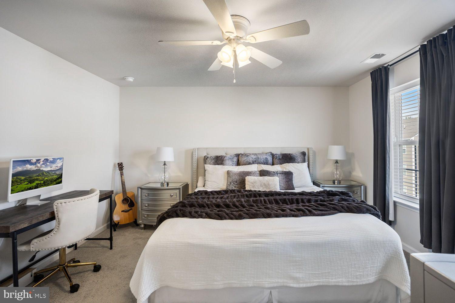 69 Sister's Farmstead Rd Mount Mount Laurel, NJ 08054 - Photo 32 of 44 a bedroom with a large bed and a chandelier