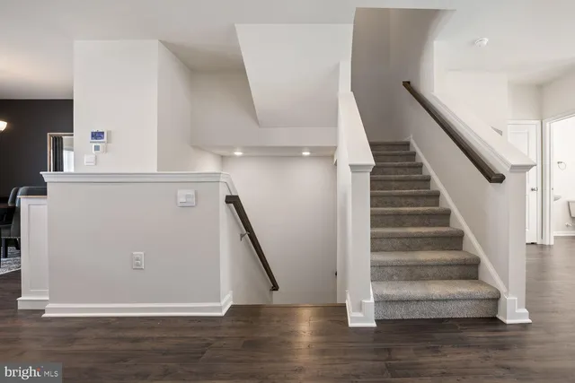 a bathroom with a sink a toilet and shower curtain
