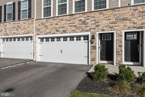 a front view of a building with a door and a window