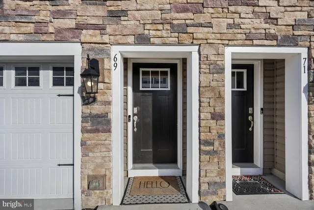 a view of bathroom with a mirror