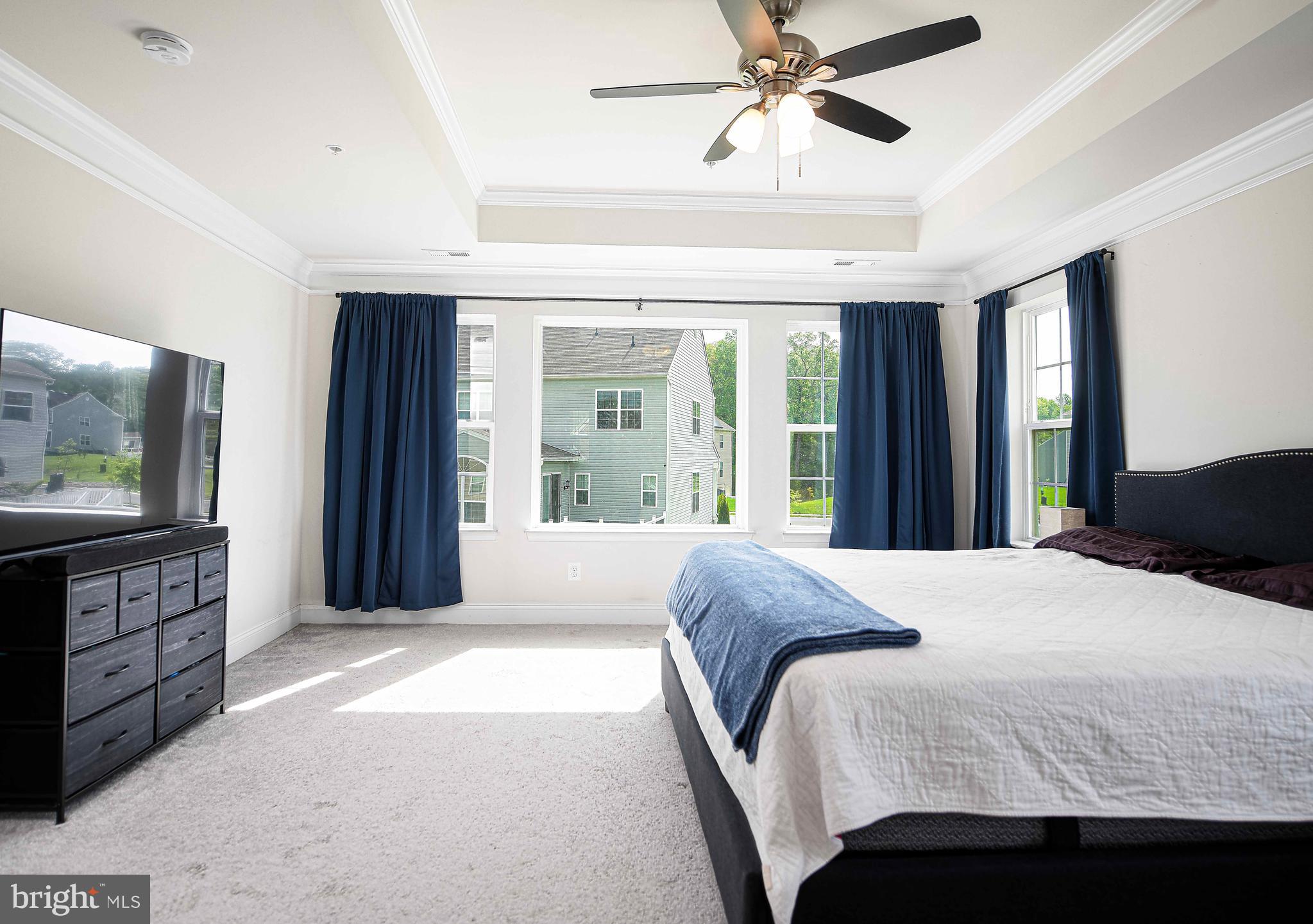 1218 Up And Over Lane Aberdeen, MD 21001 - Photo 25 of 40 a bedroom with a large bed and a chandelier
