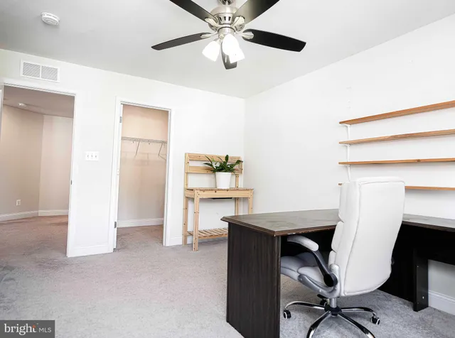 a view of a workspace with furniture