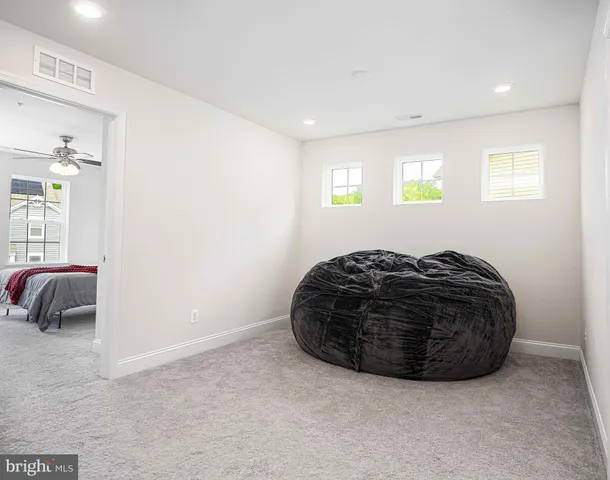 a bedroom with a bed and a chair