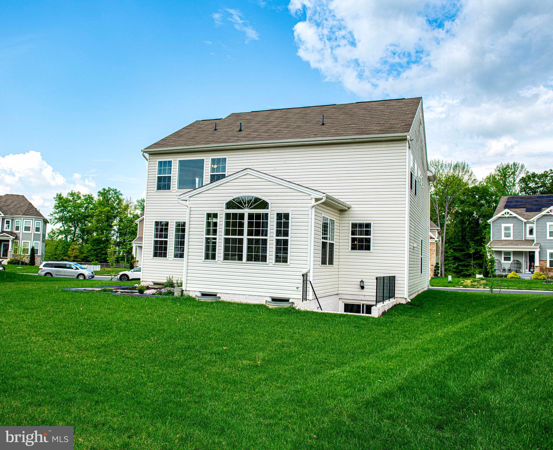 1218 Up And Over Lane Aberdeen, MD 21001 - Photo 38 of 40 a view of a white house with a big yard and large trees