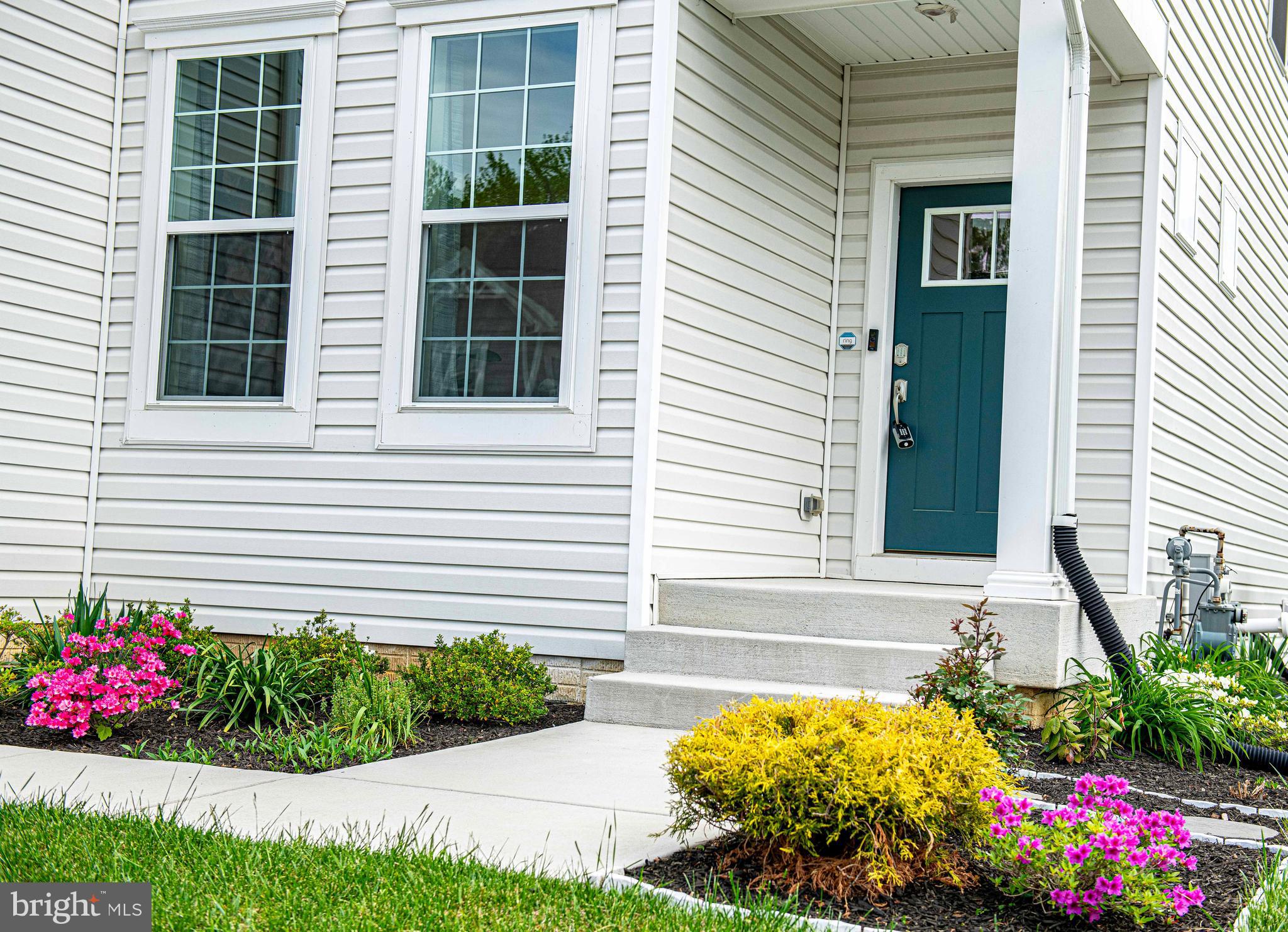1218 Up And Over Lane Aberdeen, MD 21001 - Photo 6 of 40 a front view of a house with a yard and fountain