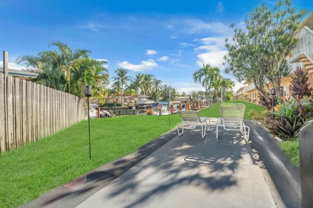 a view of a park with large trees
