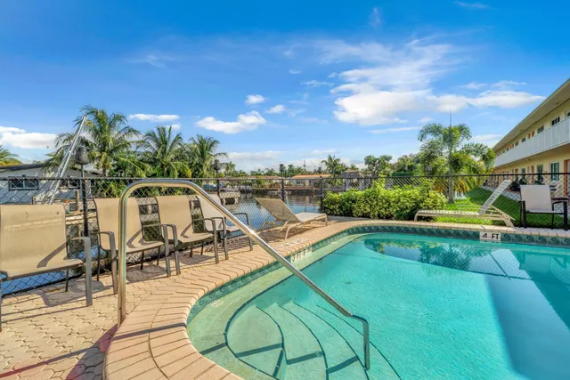 a view of a swimming pool with lounge chair
