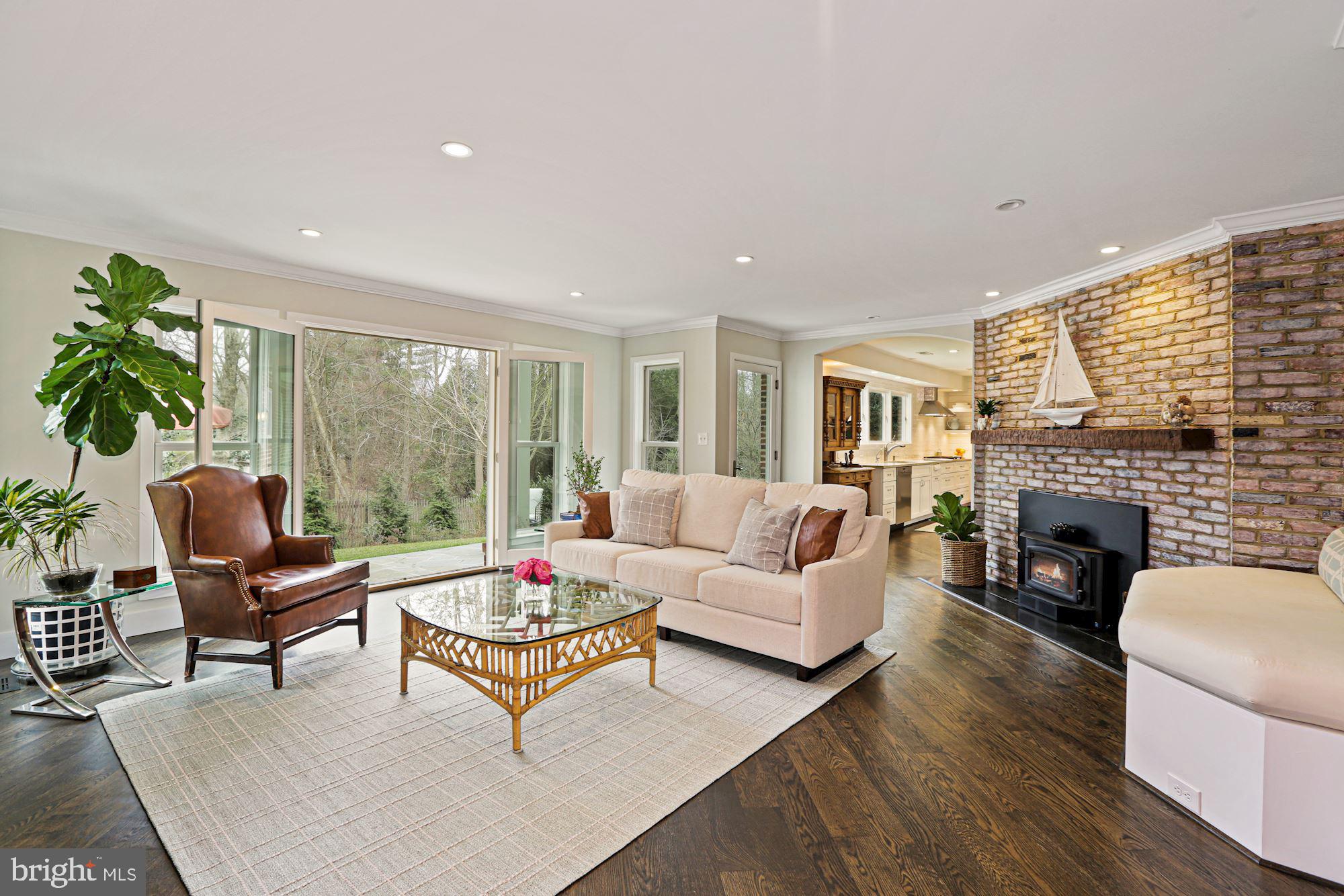 7722 Greentree Road Bethesda, MD 20817 - Photo 13 of 66 family room w/ fireplace open to kitchen