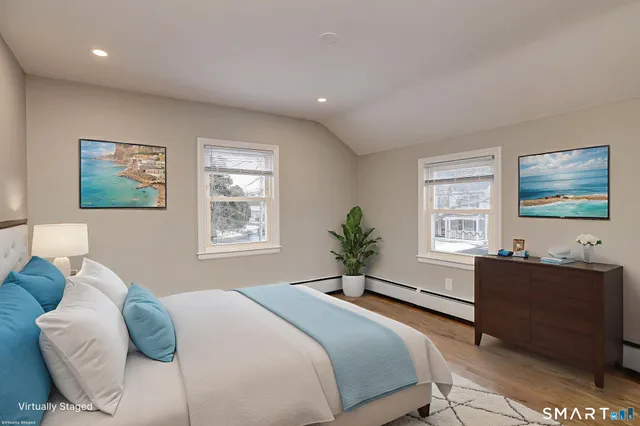 a bedroom with a bed and a furniture