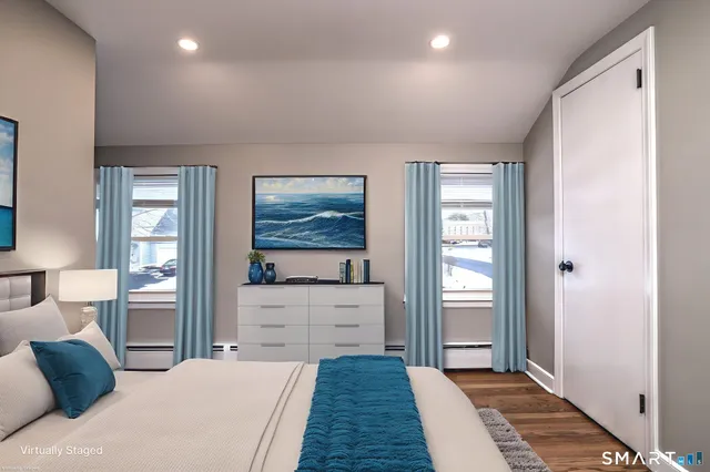 a bedroom with a bed and a dresser