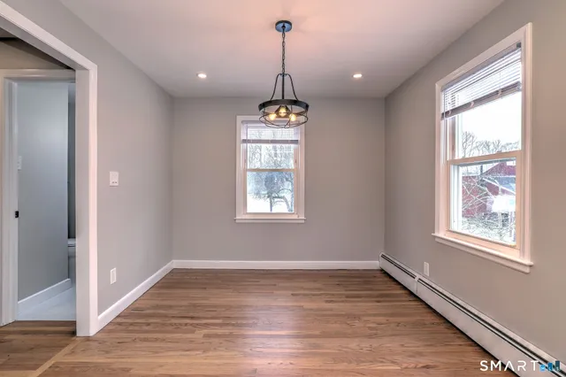 a room with window and wooden floor
