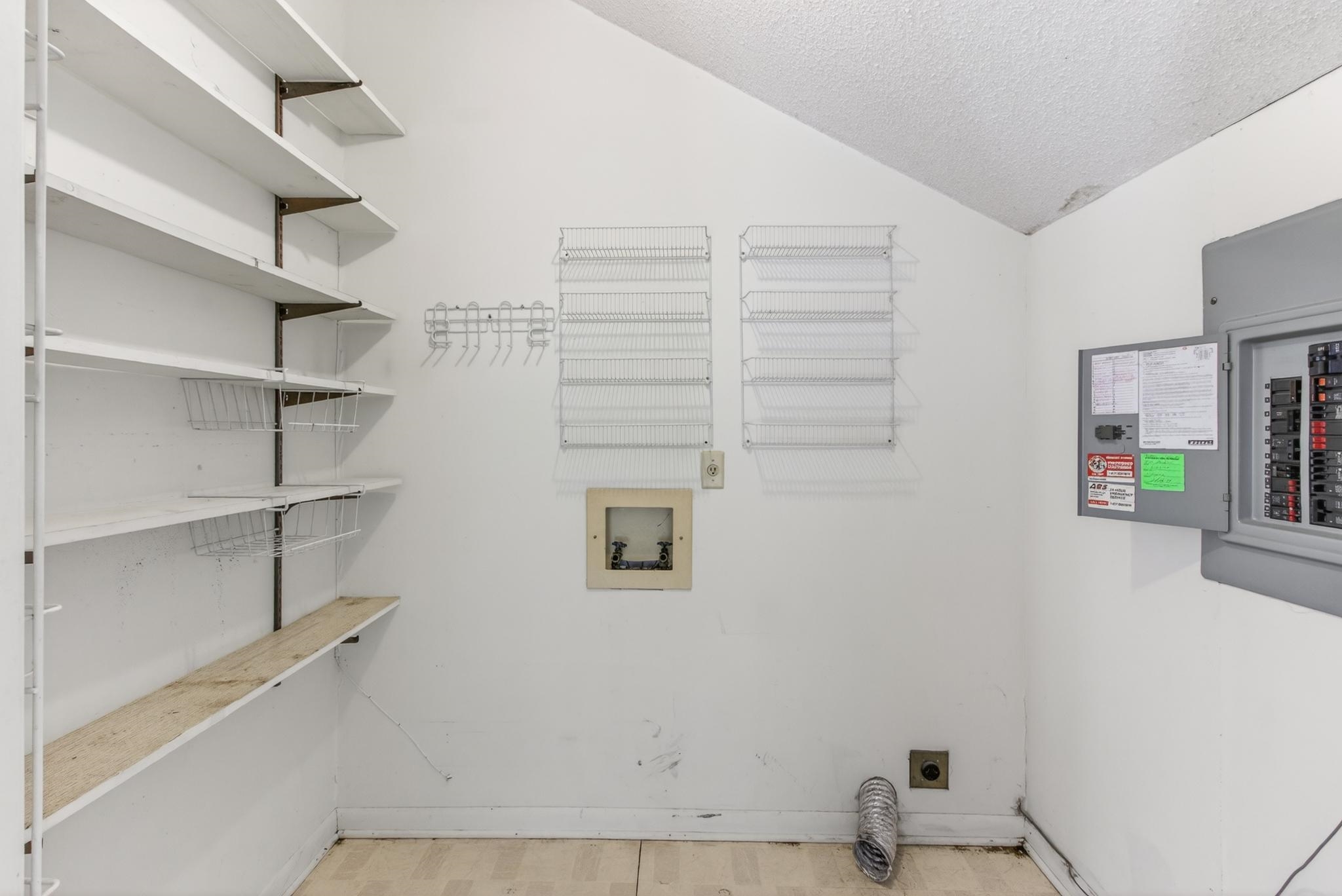 3121 Beechrun Drive Memphis, TN 38128 - Photo 16 of 40 The laundry room is good in size, and offers shelving for some extra pantry space as well.