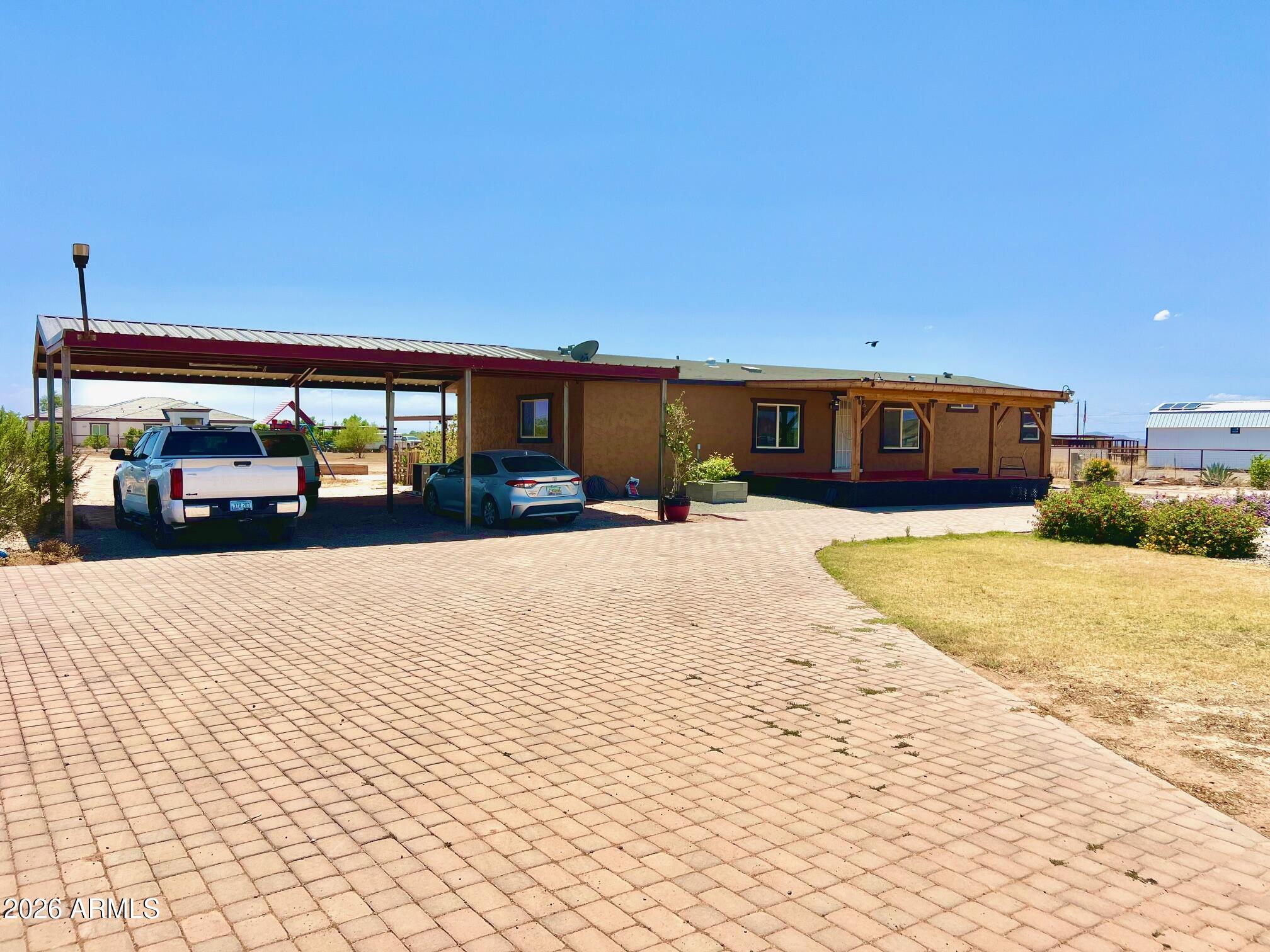 12035 East Tennyson Road Florence, AZ 85132 - Photo 33 of 42 a view of a building with cars