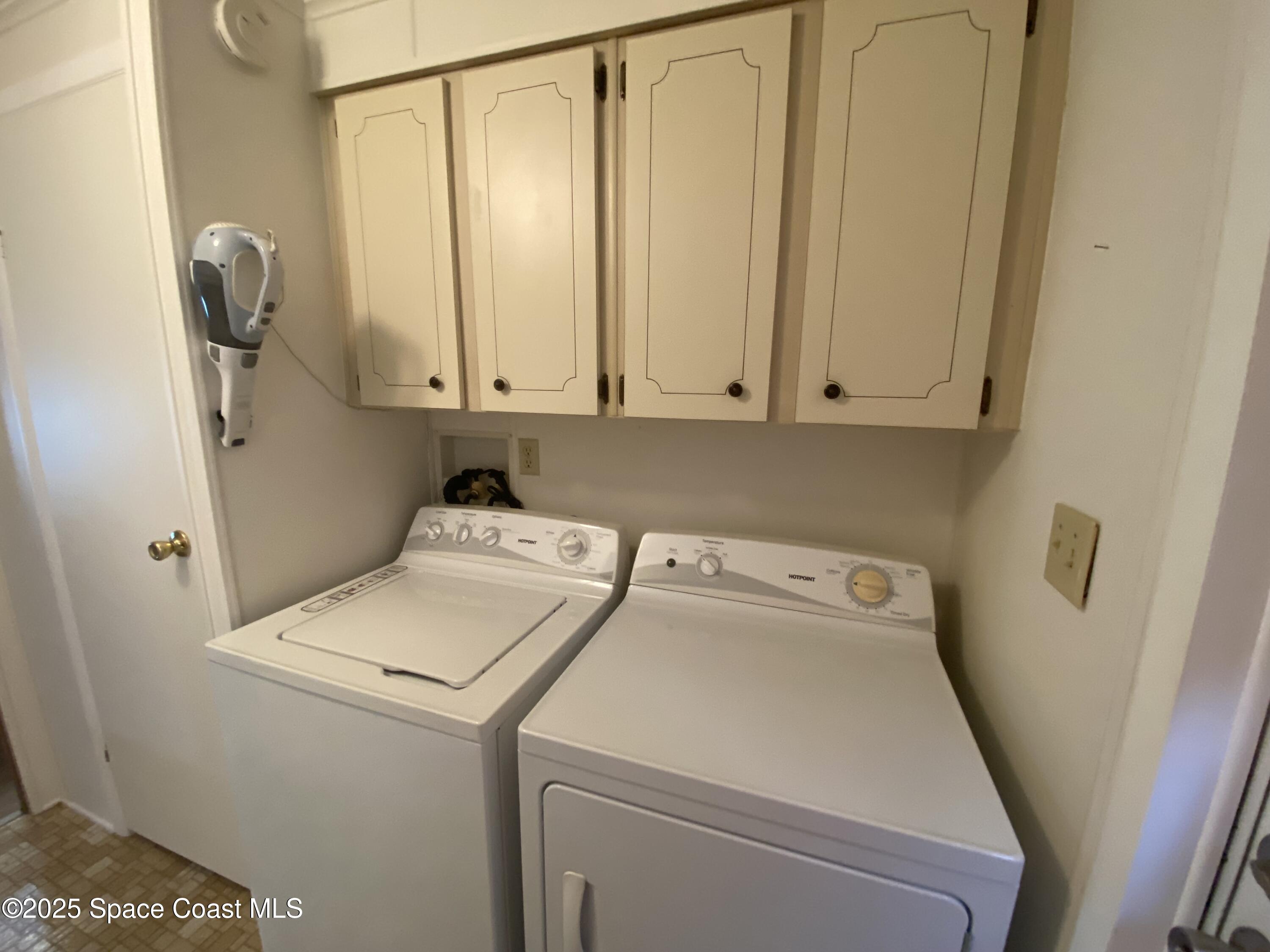 1906 Mango Street Northeast Palm Bay, FL 32905 - Photo 14 of 42 a utility room with dryer and washer