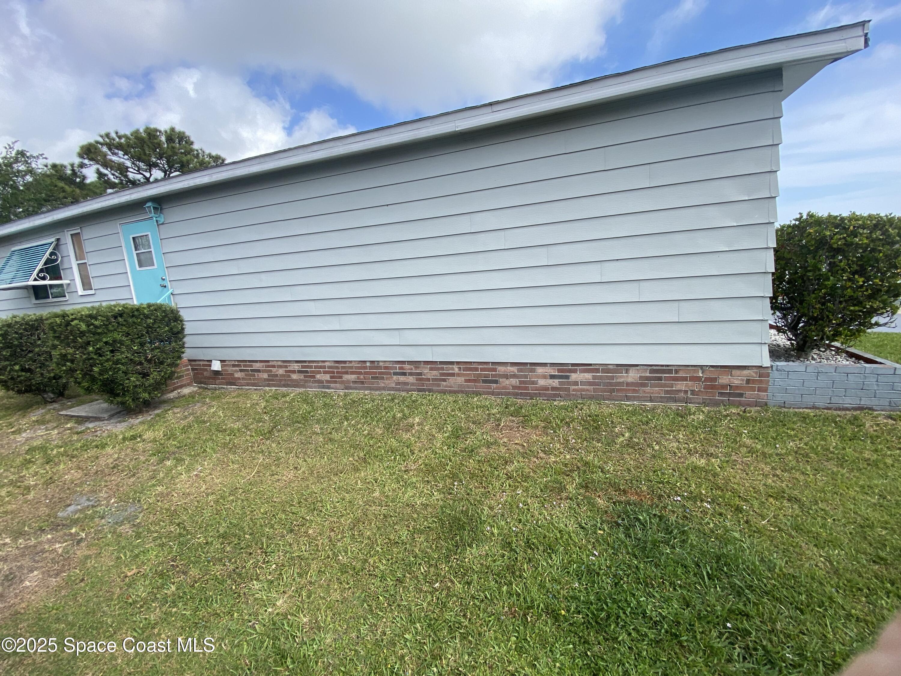 1906 Mango Street Northeast Palm Bay, FL 32905 - Photo 20 of 42 a view of a backyard with plants