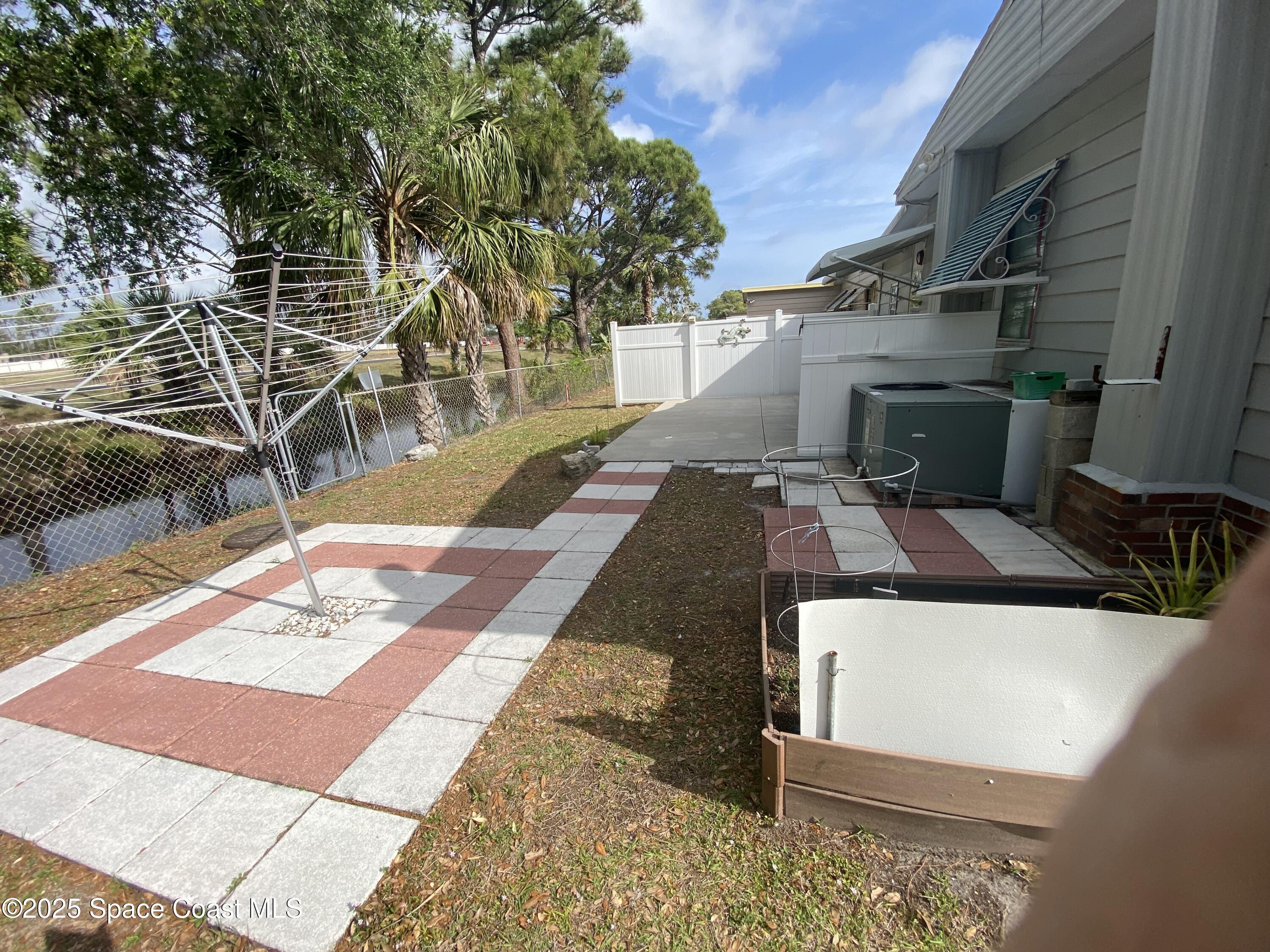 1906 Mango Street Northeast Palm Bay, FL 32905 - Photo 22 of 42 a view of a backyard with chairs