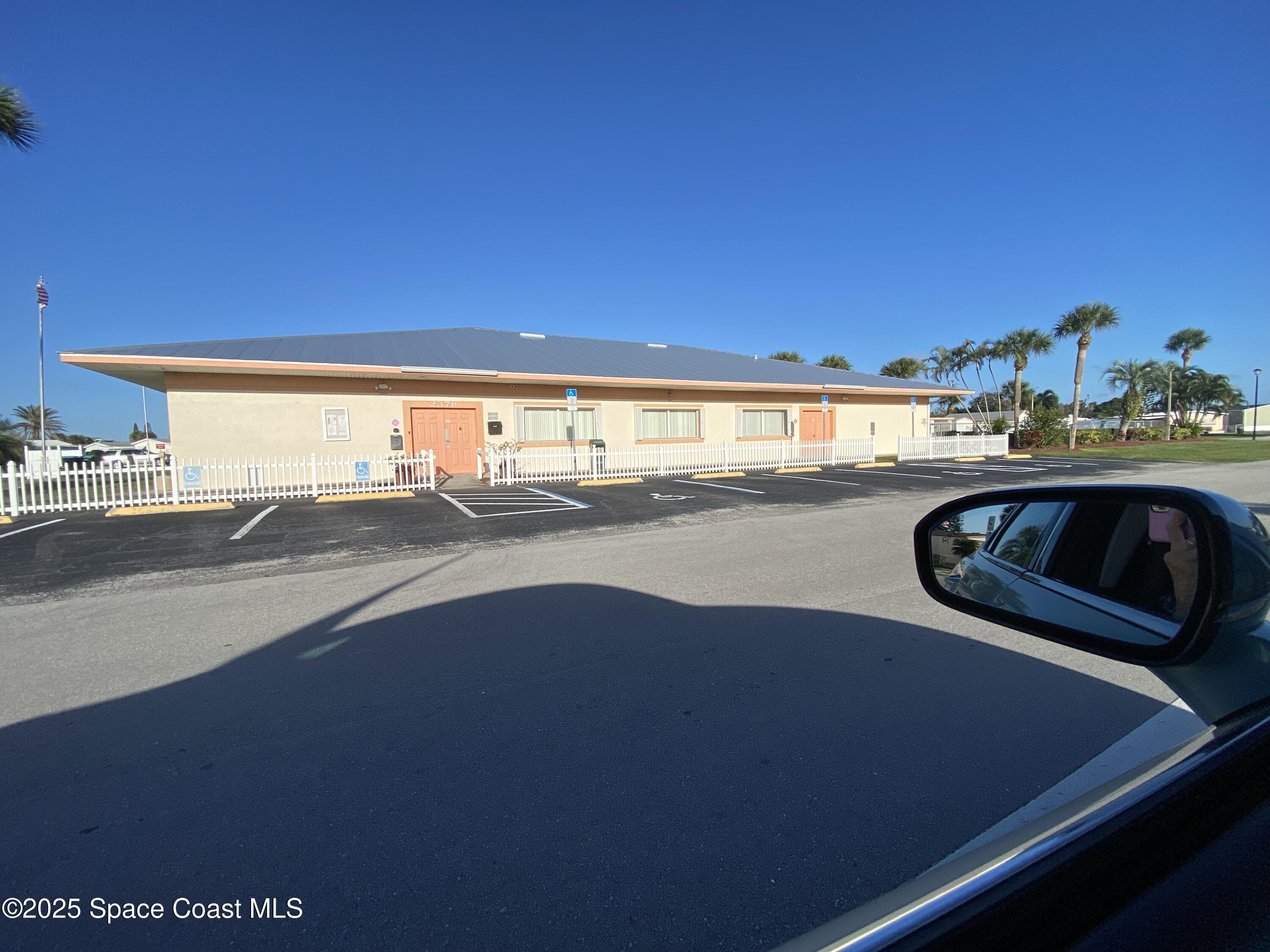 1906 Mango Street Northeast Palm Bay, FL 32905 - Photo 26 of 42 a view of a swimming pool and outdoor space