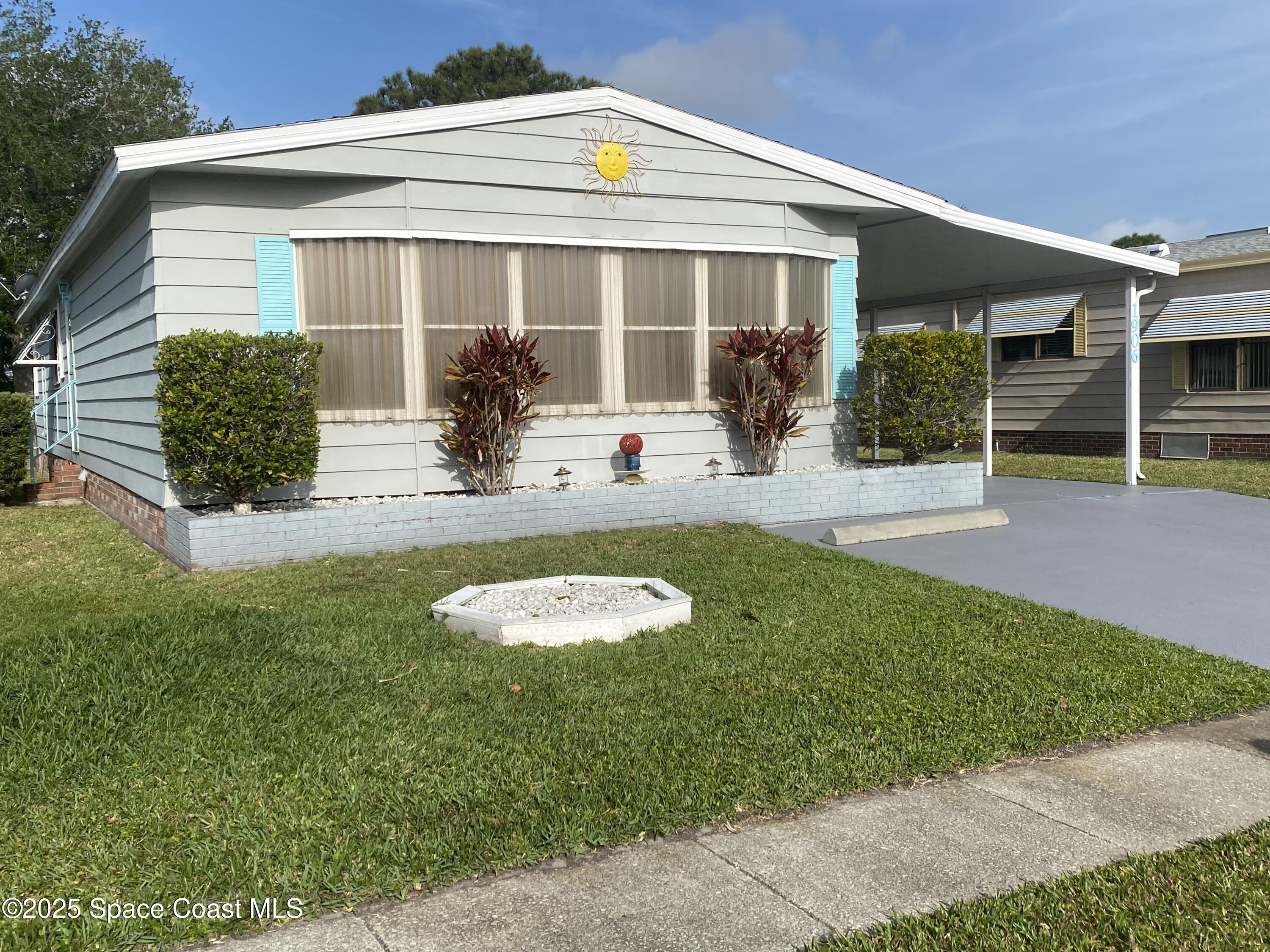 1906 Mango Street Northeast Palm Bay, FL 32905 - Photo 3 of 42 a view of a house with backyard and porch