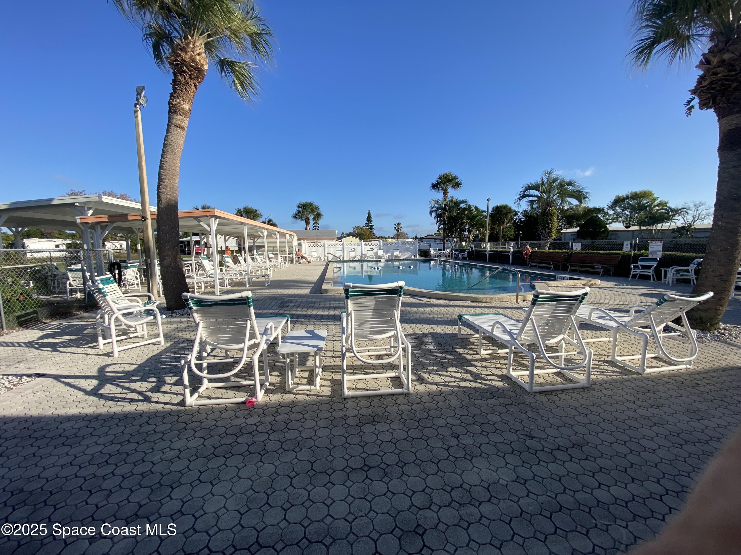 1906 Mango Street Northeast Palm Bay, FL 32905 - Photo 36 of 42 a view of a lake with chairs