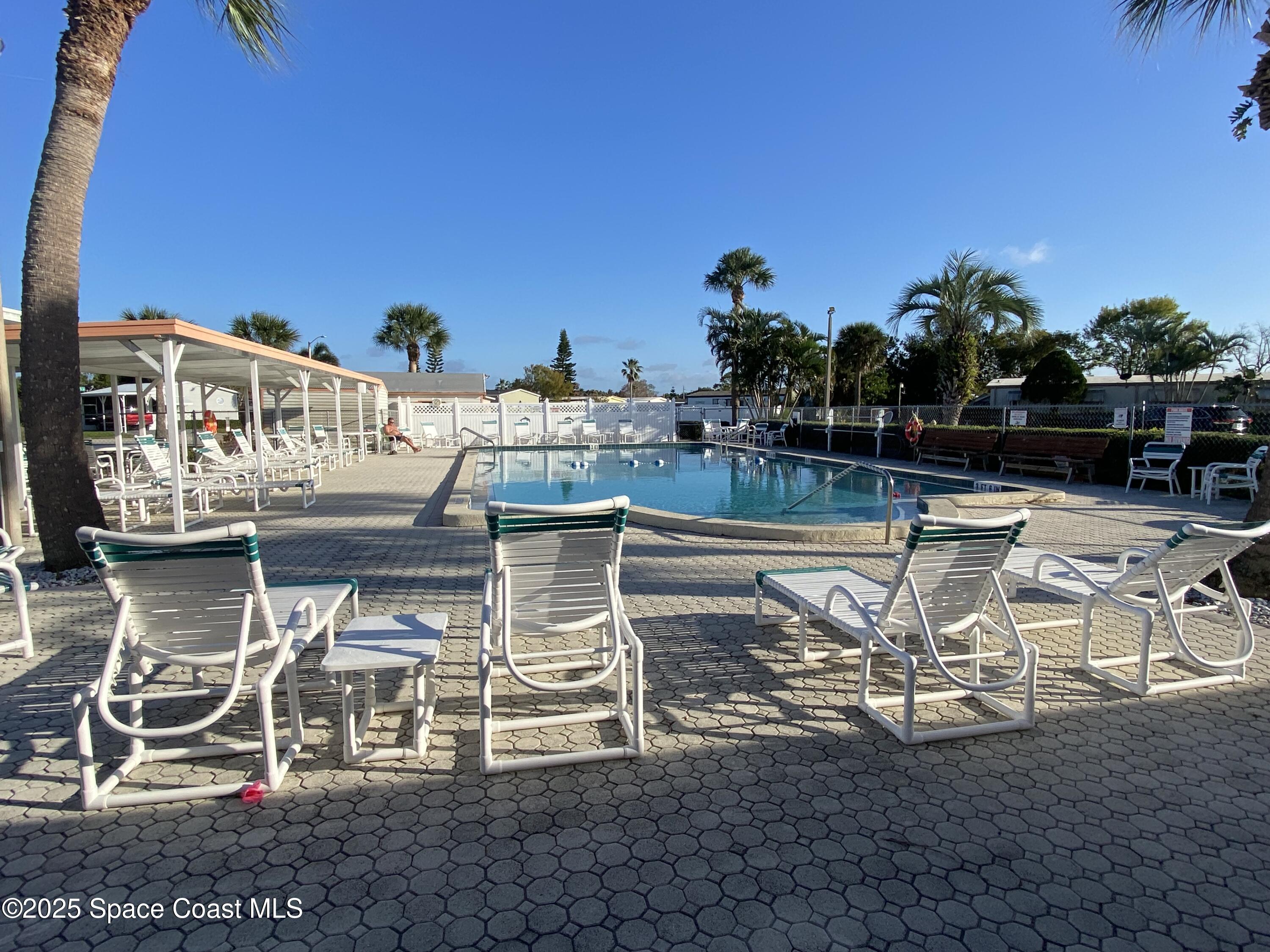1906 Mango Street Northeast Palm Bay, FL 32905 - Photo 38 of 42 a view of a chairs and table on the terrace