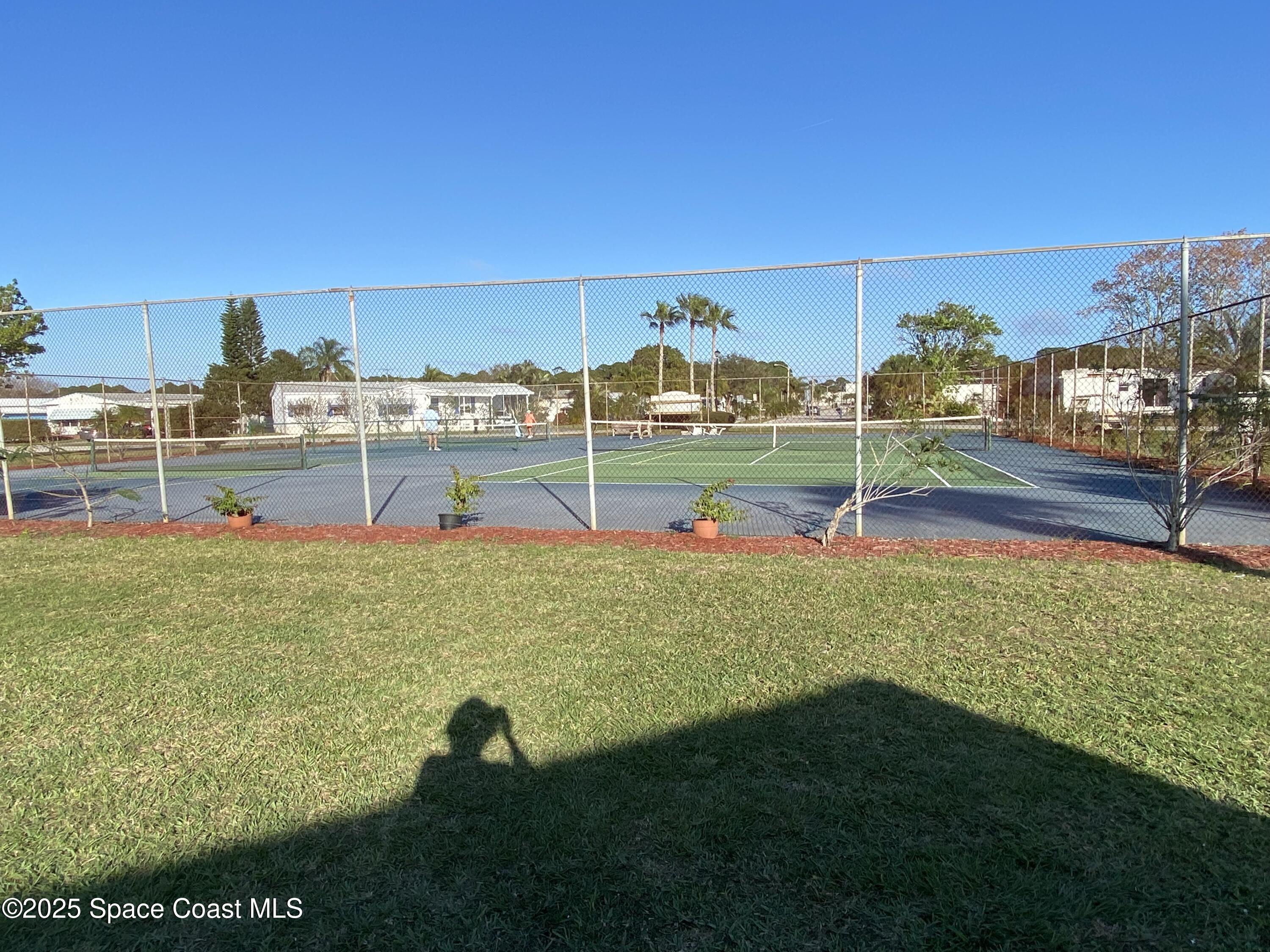 1906 Mango Street Northeast Palm Bay, FL 32905 - Photo 41 of 42 a view of a garden and swimming pool
