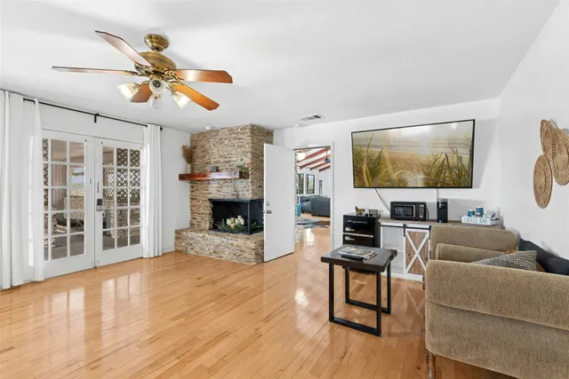 a living room with furniture and a fireplace