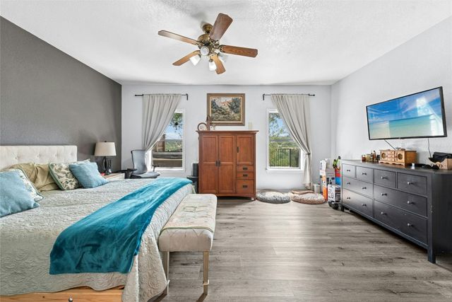 a living room with furniture and a dresser