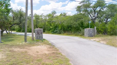 a view of a park with large trees