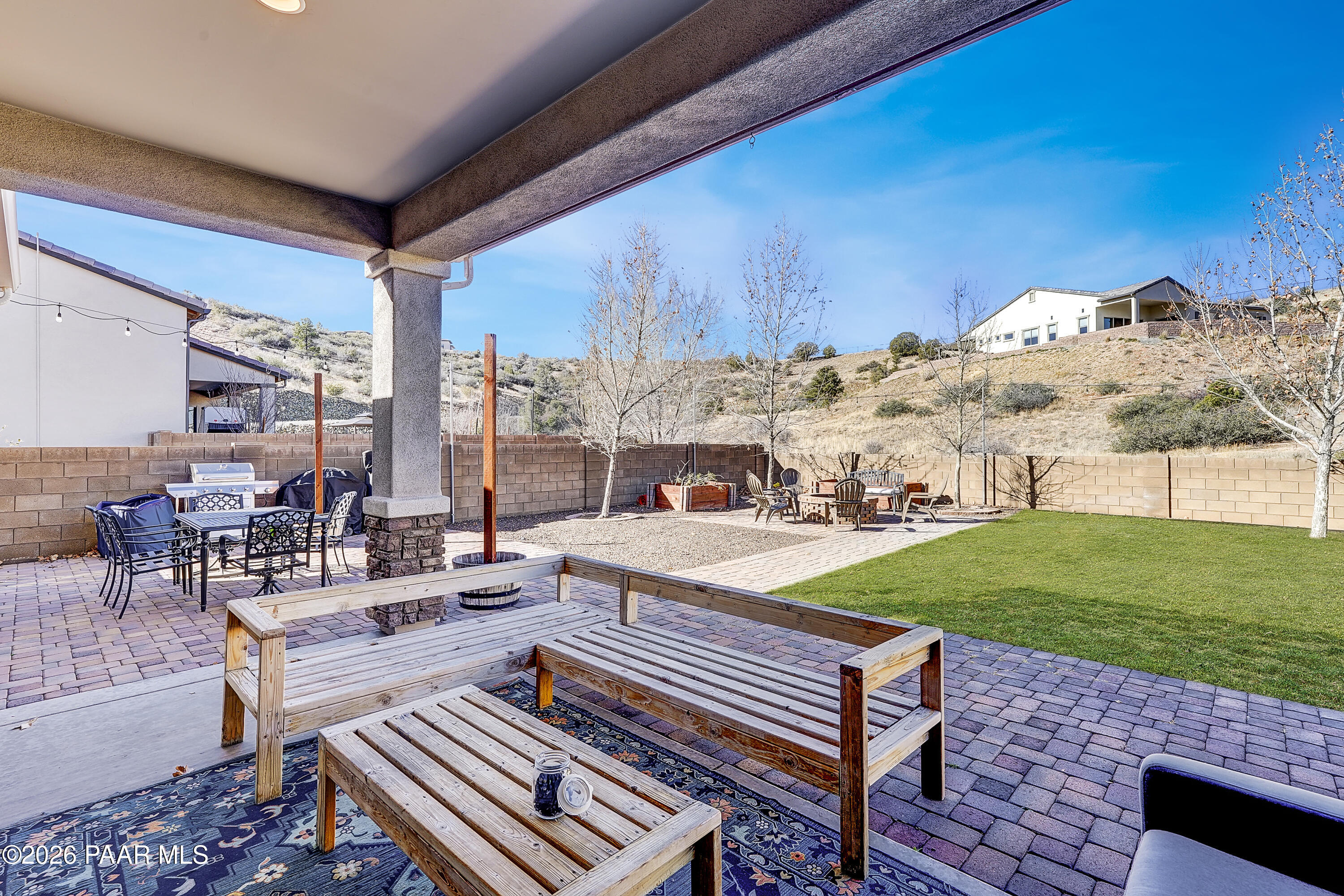 2032 Summer View Drive Prescott, AZ 86301 - Photo 11 of 17 a view of a patio with a dining table and chairs