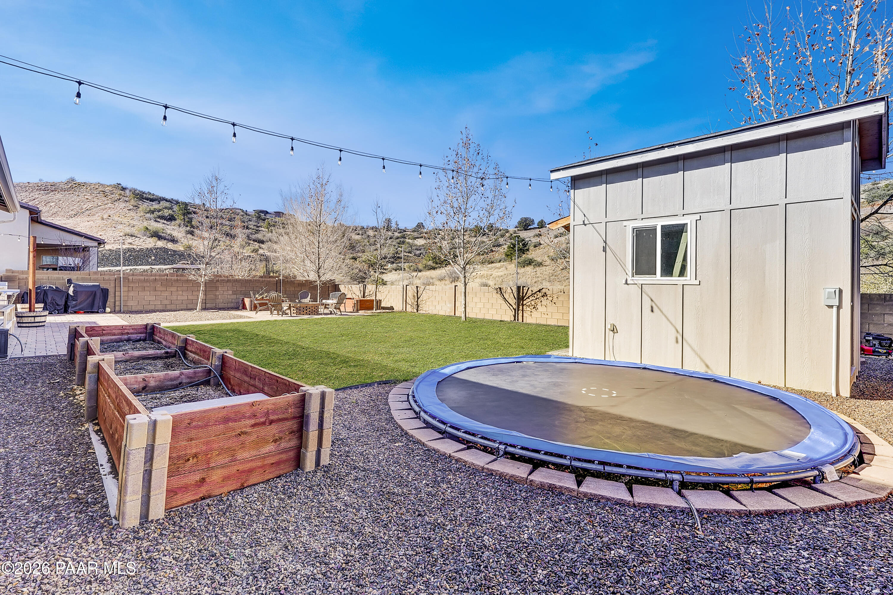 2032 Summer View Drive Prescott, AZ 86301 - Photo 14 of 17 a view of a backyard with a tub and fire pit