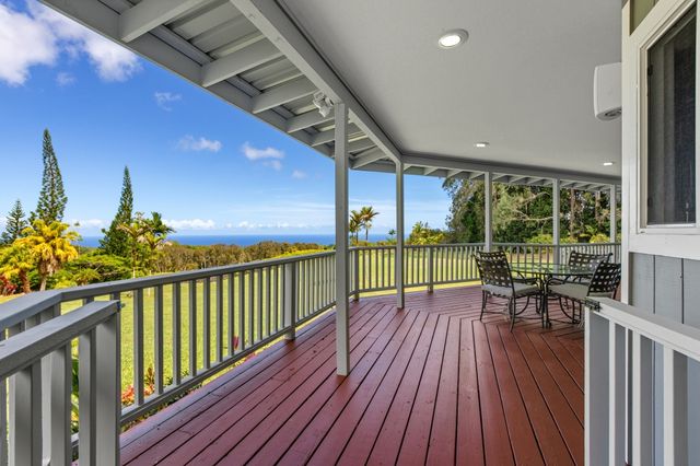 a view of balcony with furniture