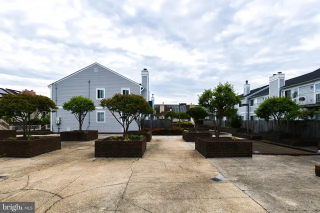 a swimming pool with outdoor seating and yard