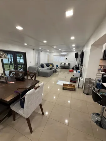 a view of a swimming pool and lounge chairs