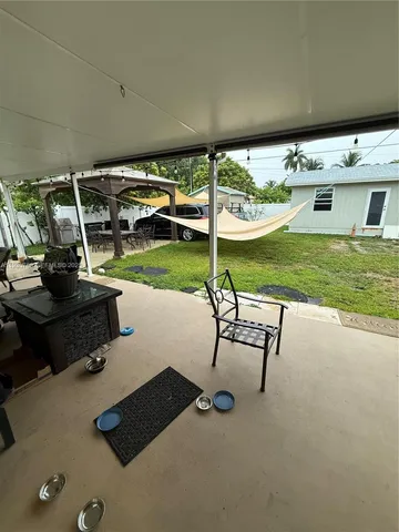 a large room with gym equipment and lots of living room view