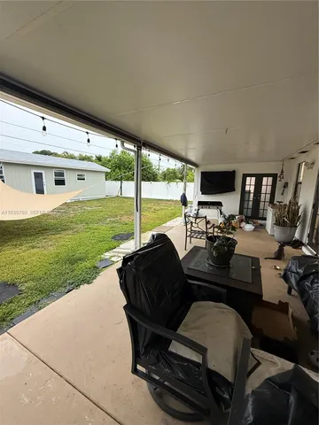 a room with furniture and a window