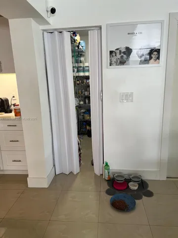 a kitchen with stainless steel appliances granite countertop a refrigerator and a stove