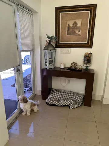 a kitchen with a sink a stove and chairs
