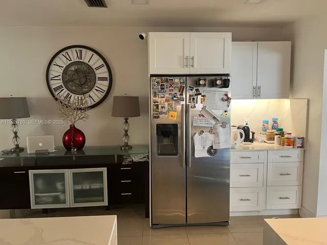 a kitchen with a stove a sink and a microwave