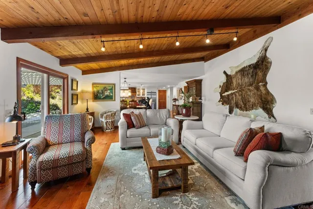 a bedroom with bed and a chandelier