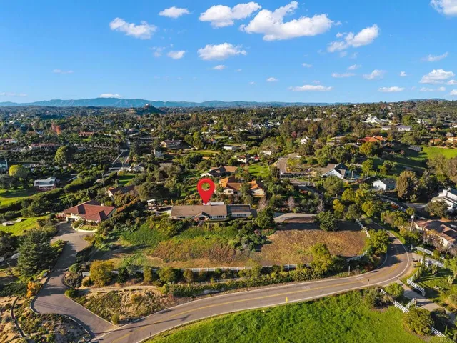 an aerial view of a house with outdoor space patio and swimming pool