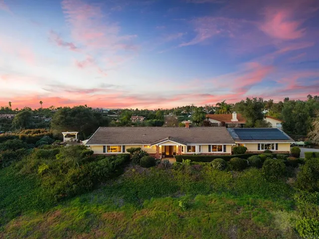 a view of a swimming pool with a yard