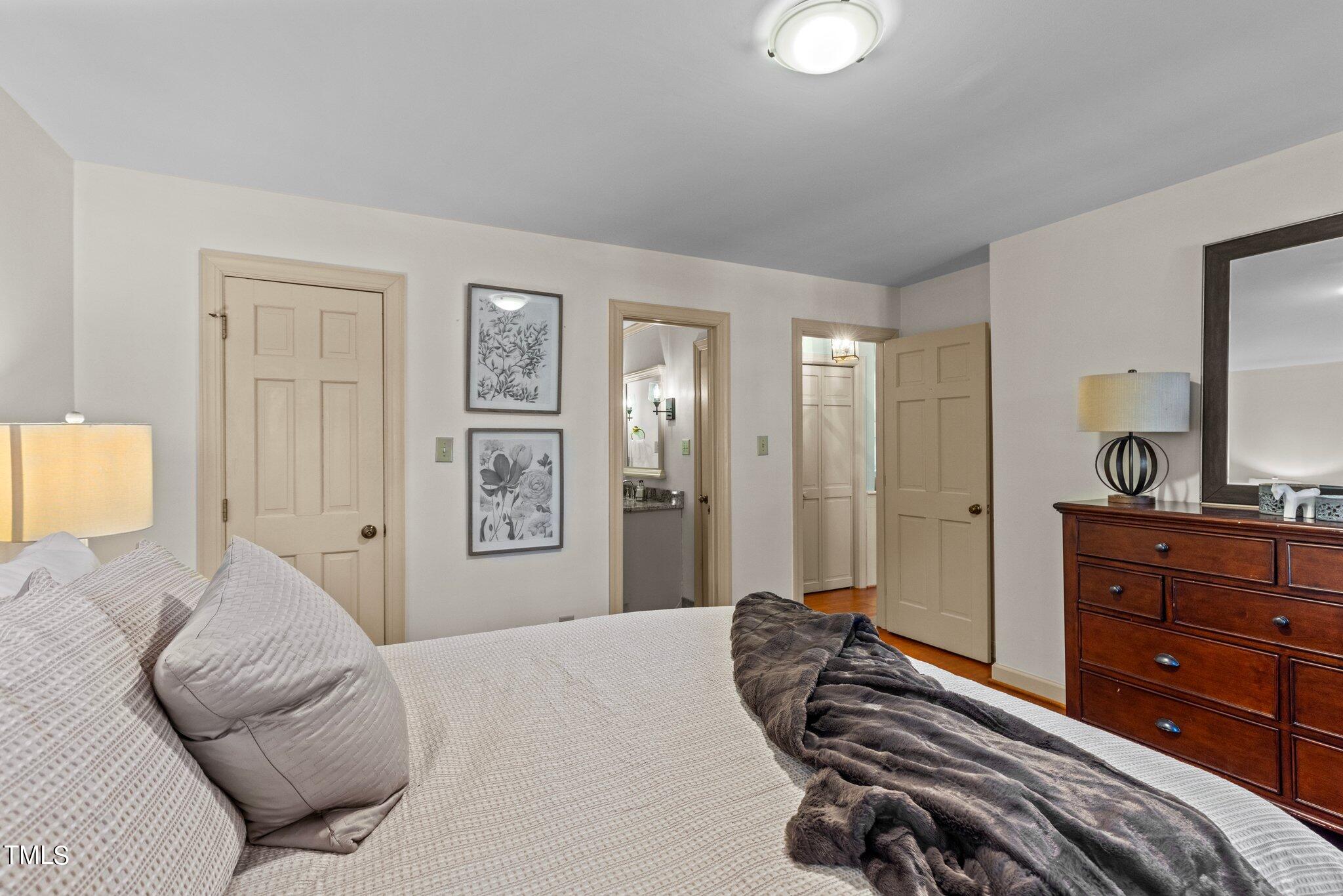7132 Sandringham Drive Raleigh, NC 27613 - Photo 17 of 35 a bedroom with a bed and a dresser