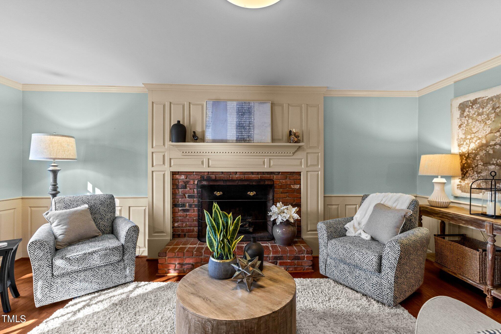 7132 Sandringham Drive Raleigh, NC 27613 - Photo 5 of 35 a living room with furniture and a fireplace