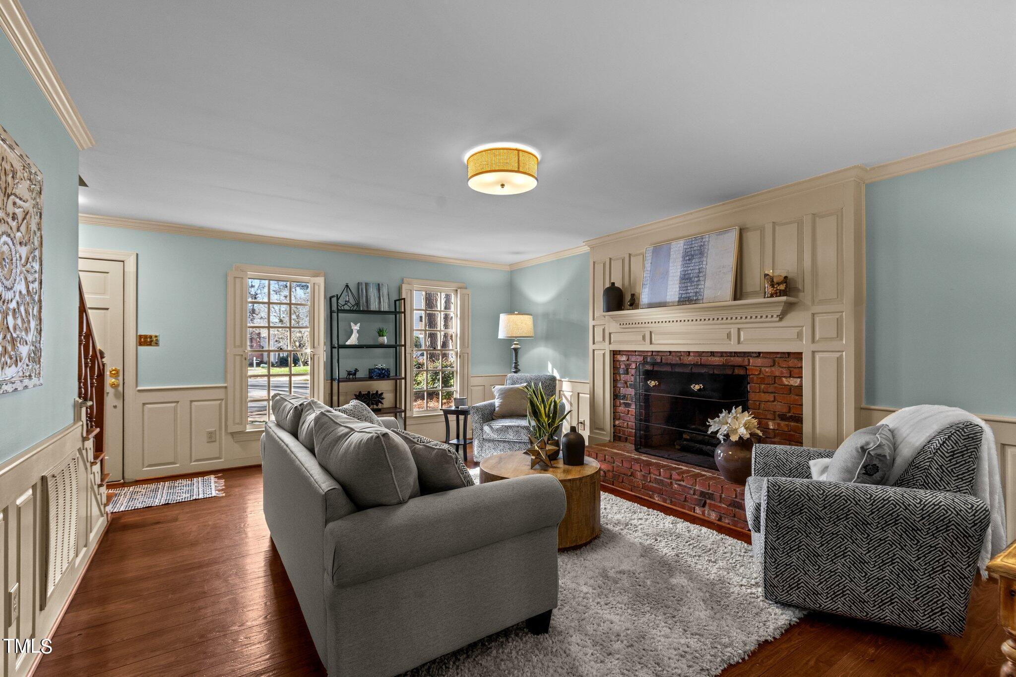 7132 Sandringham Drive Raleigh, NC 27613 - Photo 6 of 35 a living room with furniture and a fireplace