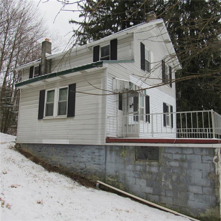 290 Foxburg Road Normalville, PA 15469 - Photo 2 of 19 a view of a white house with large windows